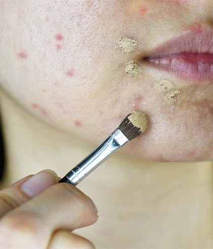 "Cleaning makeup brushes to prevent bacteria and clogged pores"