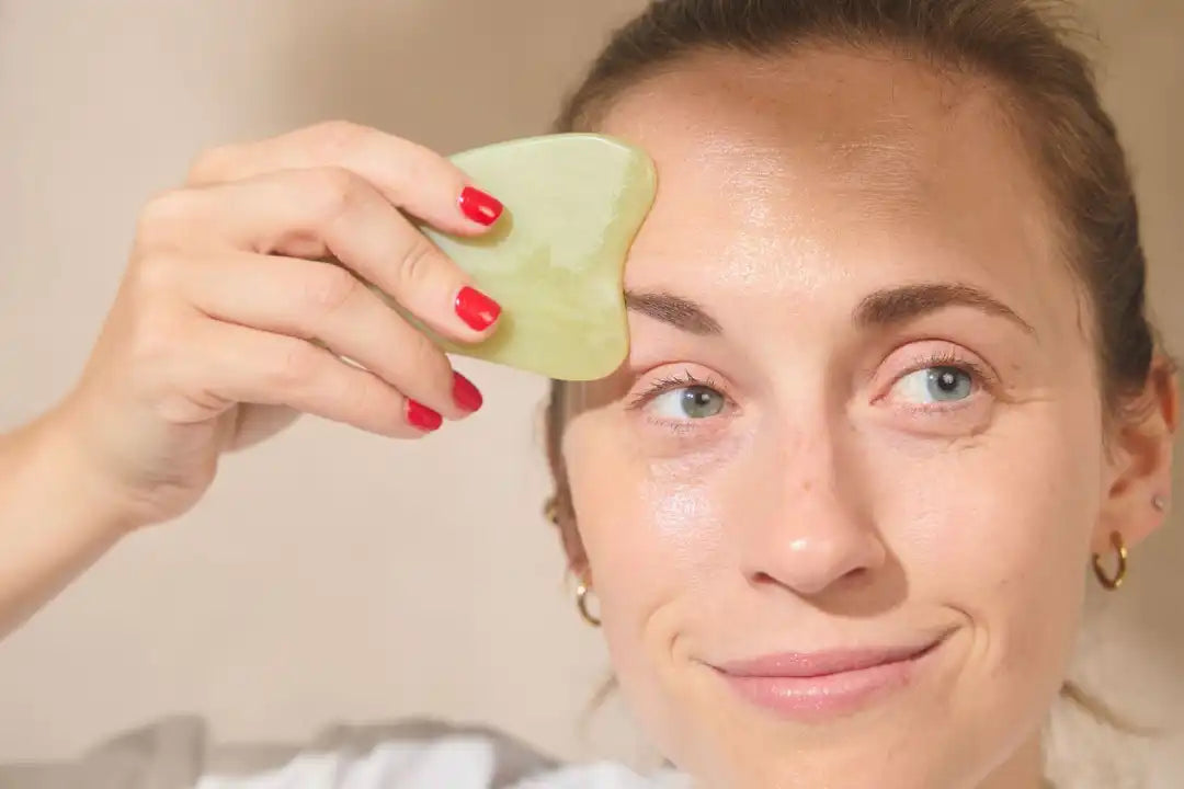 ALT Gua sha and jade roller facial massage tools used in a skincare routine
