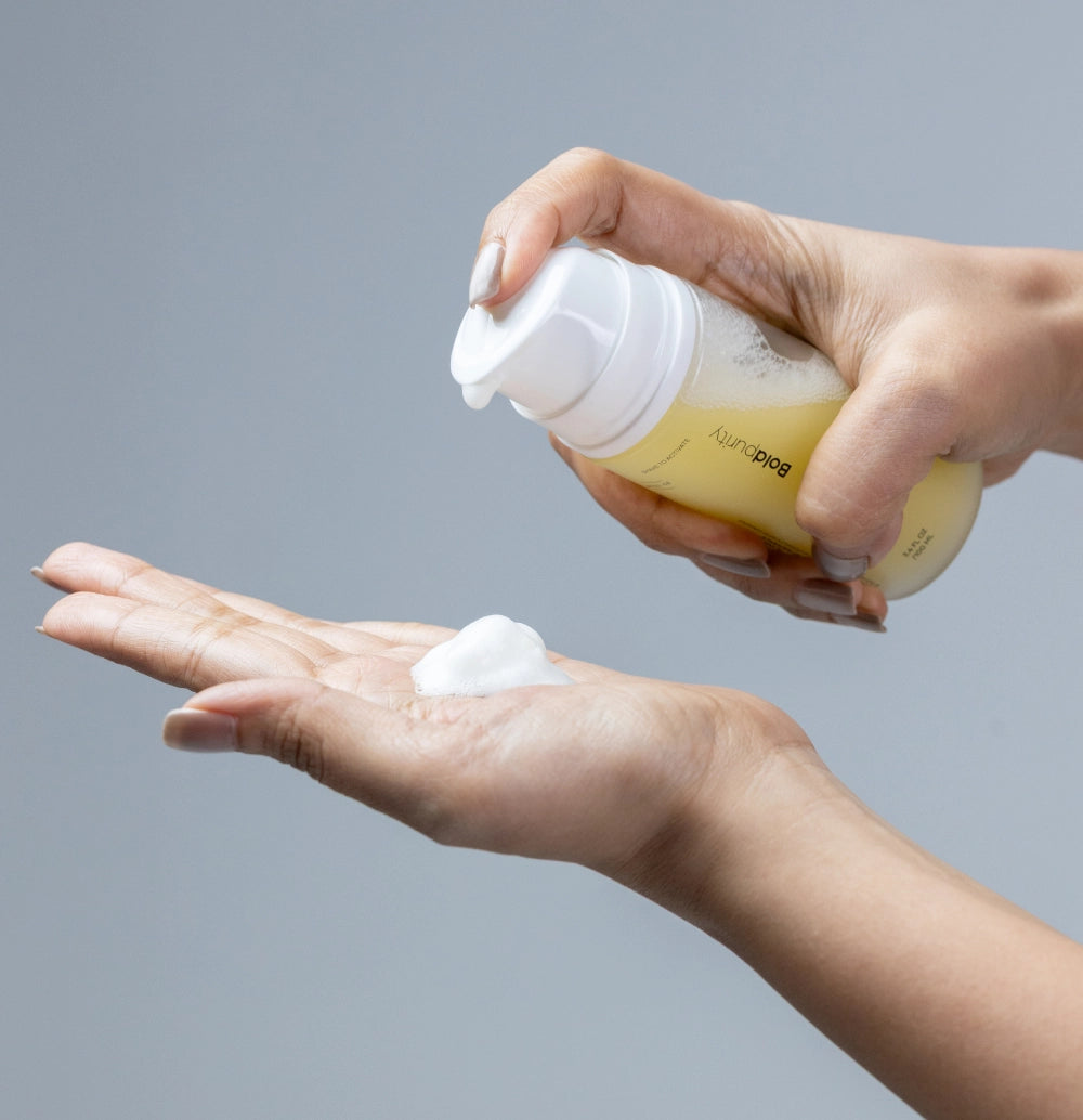 Person dispensing Aquablur foaming toner onto their hand.